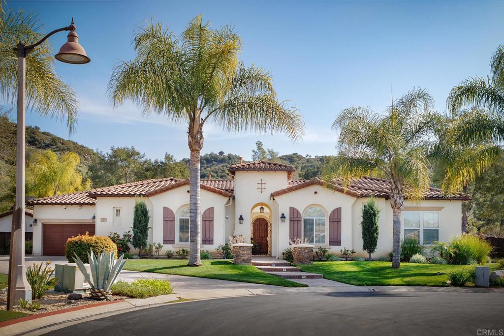 14275 Pebble Beach Way Valley Center, CA 92082 - Photo 1 of 1 a front view of multiple houses with yard and green space