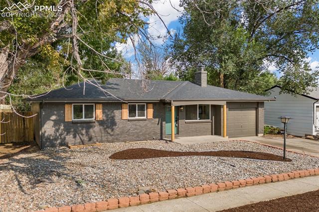 1911 Monterey Road Colorado Springs, CO 80910 - Photo 2 of 30 Ranch-style house with a garage