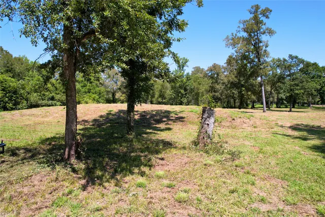 an aerial view of a houses with a lake view