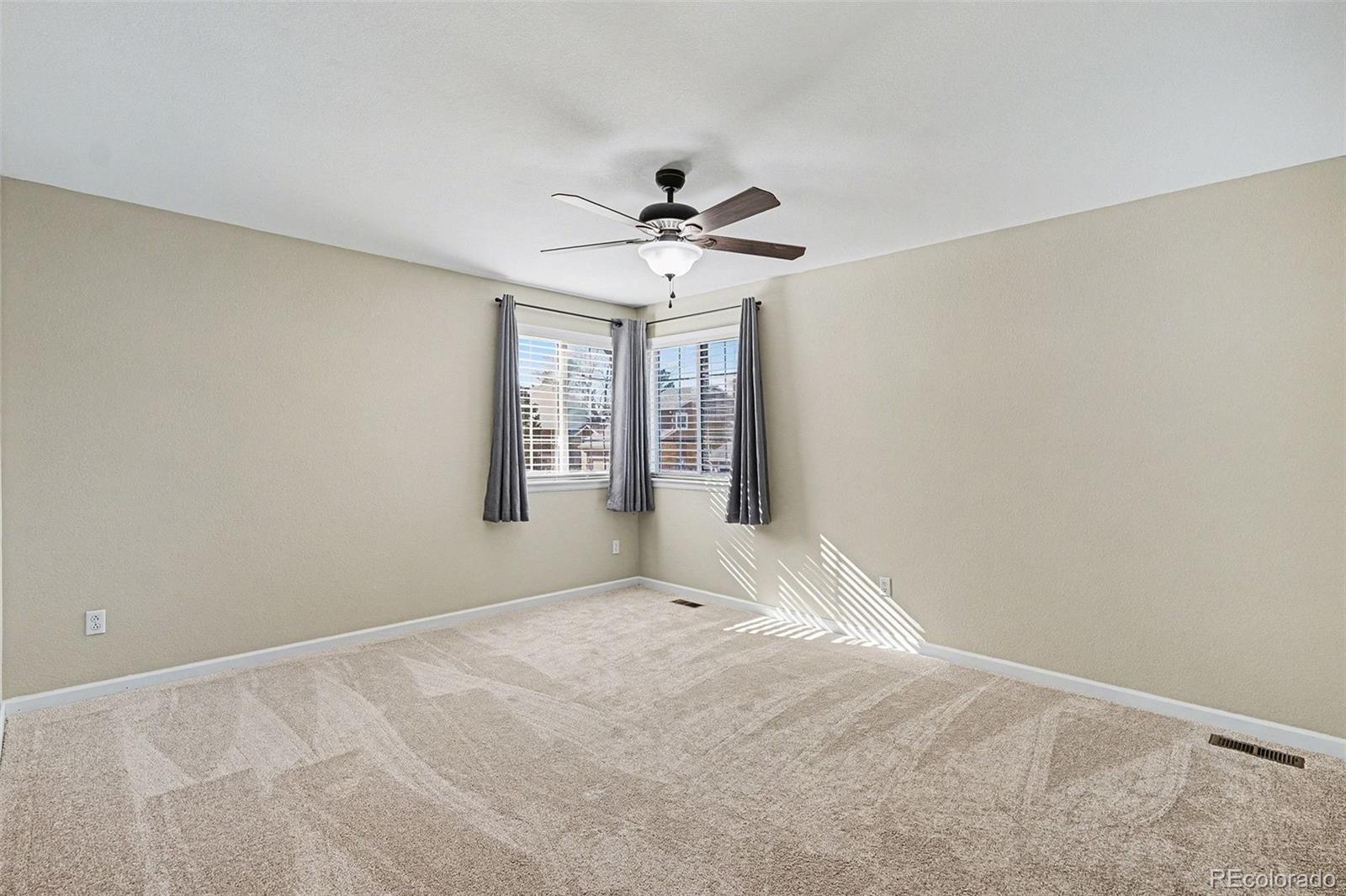 8046 Lodgepole Trail Lone Tree, CO 80124 - Photo 25 of 34 a view of an empty room with a window