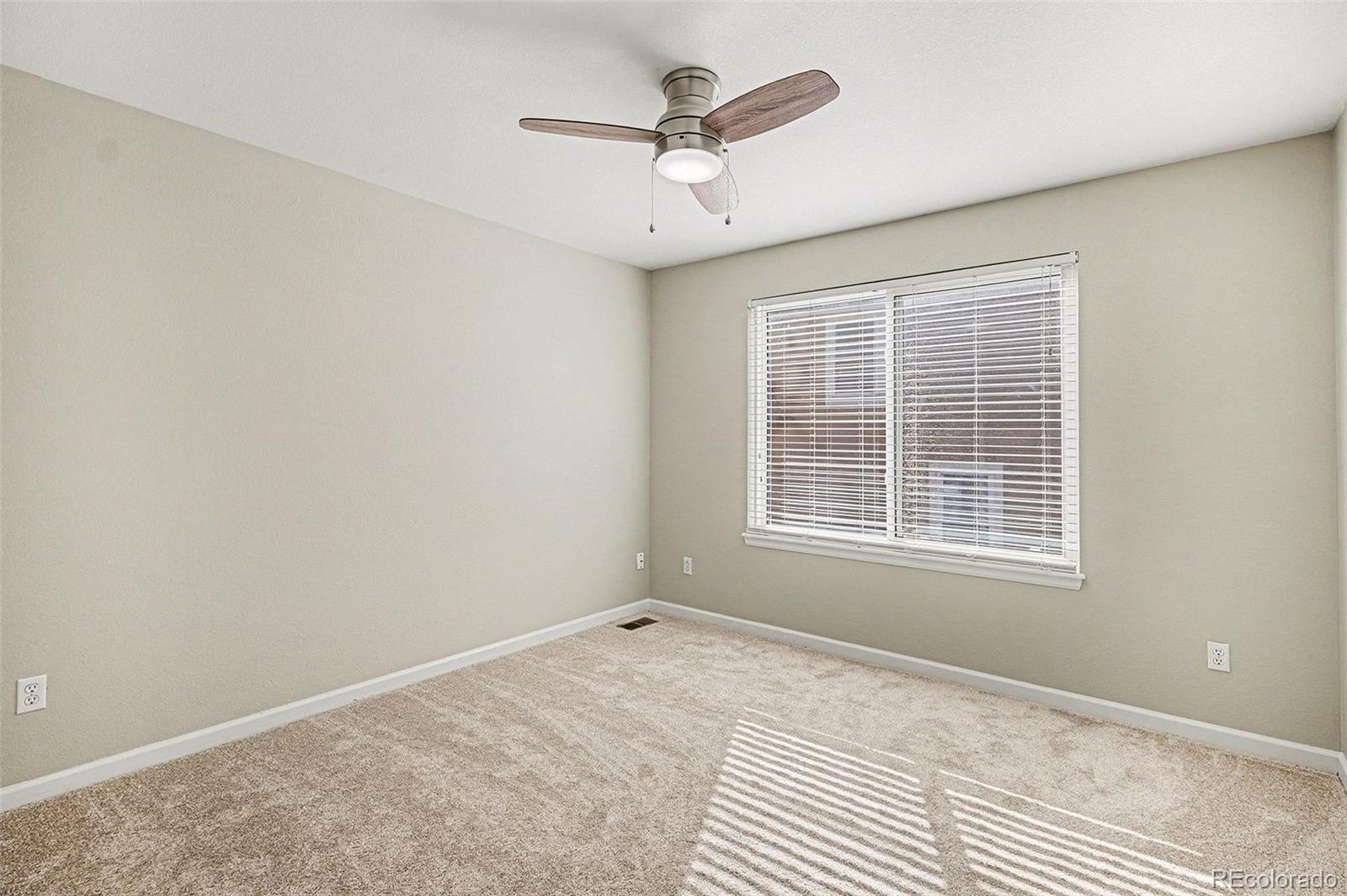 8046 Lodgepole Trail Lone Tree, CO 80124 - Photo 27 of 34 a view of an empty room with a window