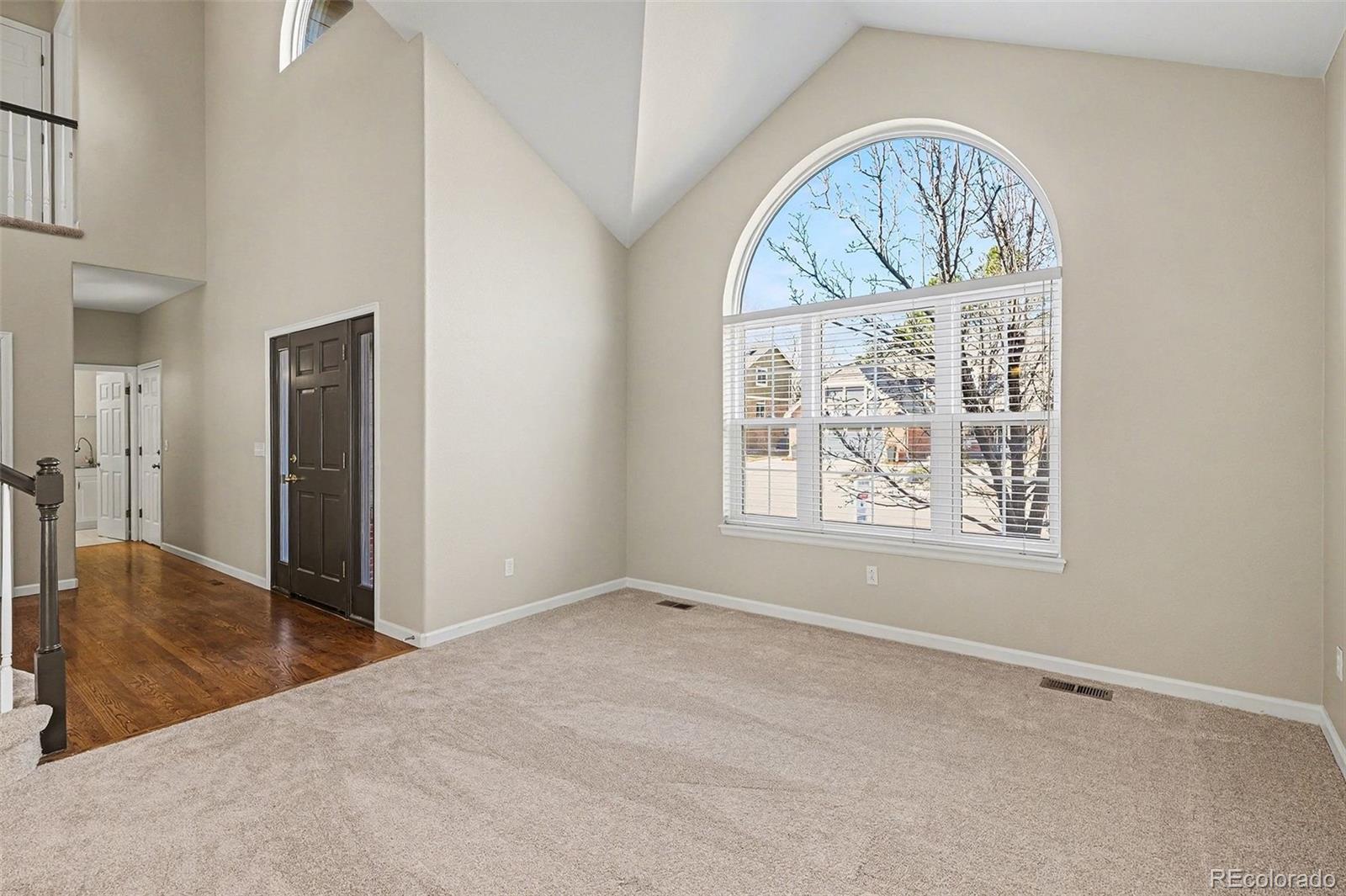 8046 Lodgepole Trail Lone Tree, CO 80124 - Photo 3 of 34 an empty room with a window
