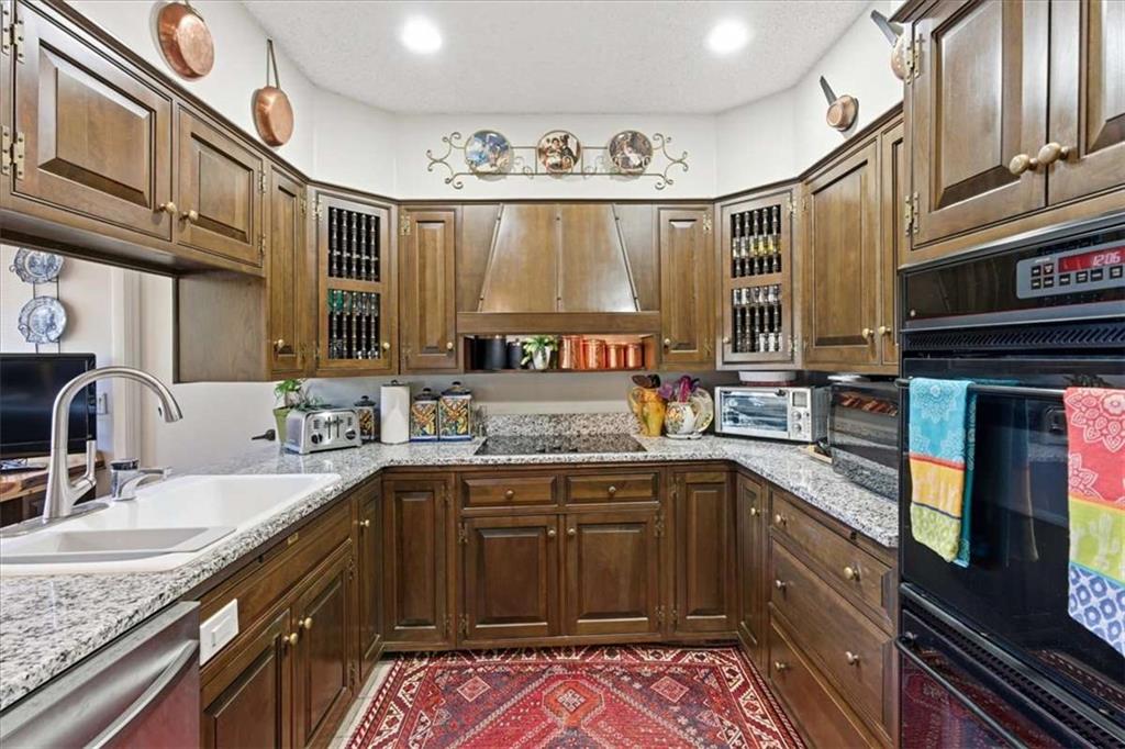 1509 High Point Road Bowdon, GA 30108 - Photo 12 of 47 a kitchen with stainless steel appliances granite countertop a sink stove and cabinets