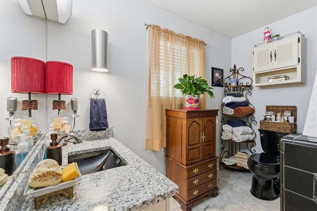 1509 High Point Road Bowdon, GA 30108 - Photo 22 of 47 a kitchen with a refrigerator and a stove