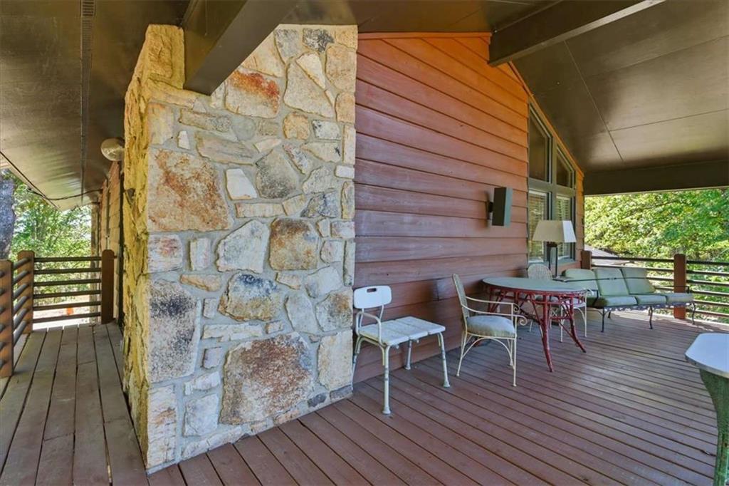 1509 High Point Road Bowdon, GA 30108 - Photo 23 of 47 a balcony with table and chairs