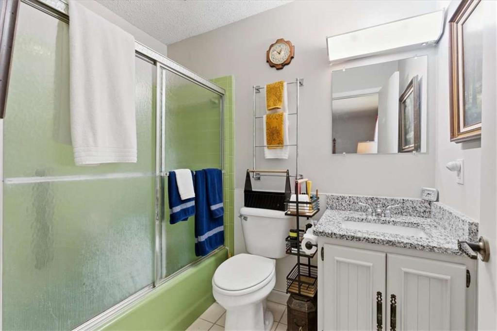 1509 High Point Road Bowdon, GA 30108 - Photo 26 of 47 a bathroom with a granite countertop toilet sink and mirror