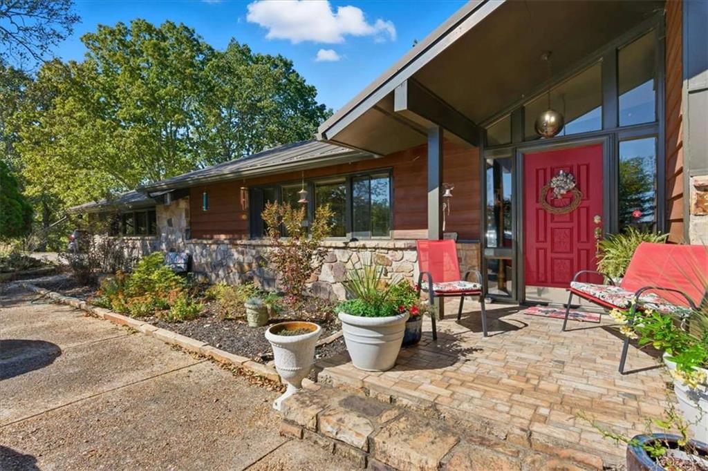 1509 High Point Road Bowdon, GA 30108 - Photo 3 of 47 a view of a chairs and tables in patio