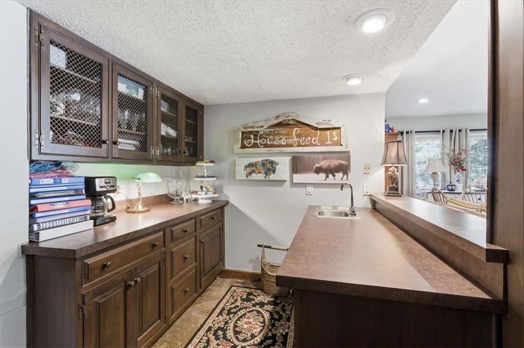 1509 High Point Road Bowdon, GA 30108 - Photo 31 of 47 a kitchen with stainless steel appliances a stove a sink and a refrigerator
