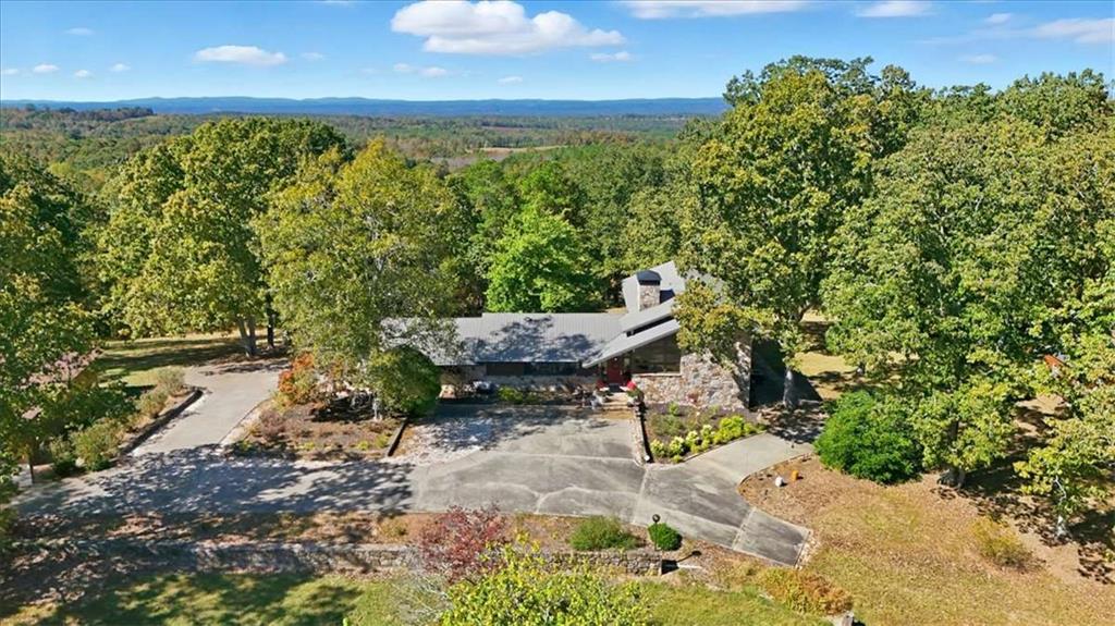 1509 High Point Road Bowdon, GA 30108 - Photo 44 of 47 a backyard of a house with yard and outdoor seating
