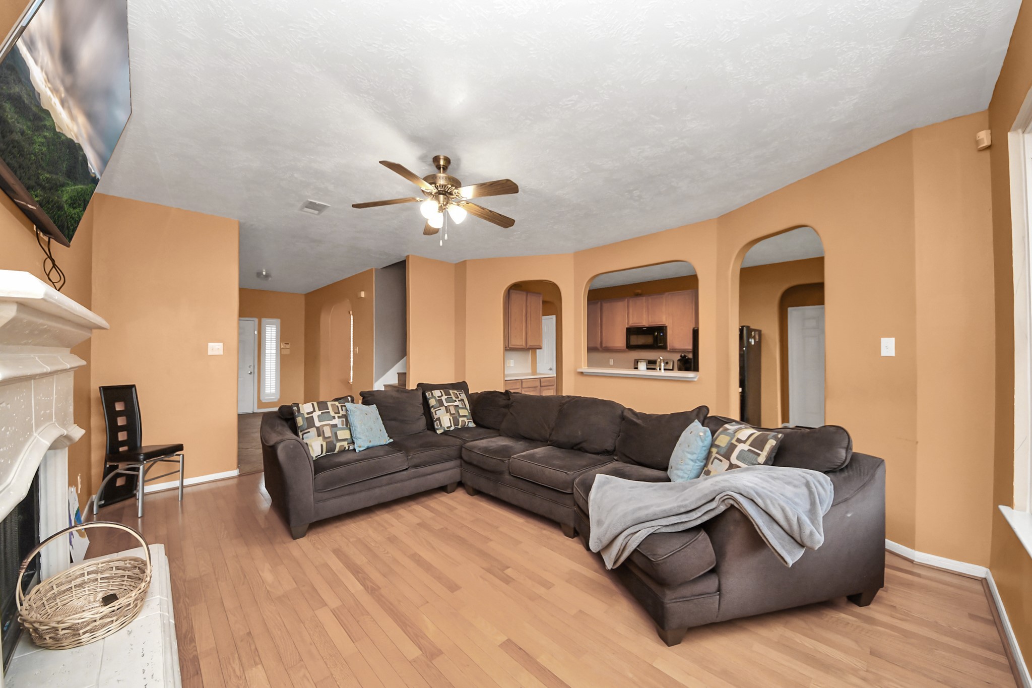 23814 Spring Dane Drive Spring, TX 77373 - Photo 15 of 41 a living room with furniture a flat screen tv and a fireplace