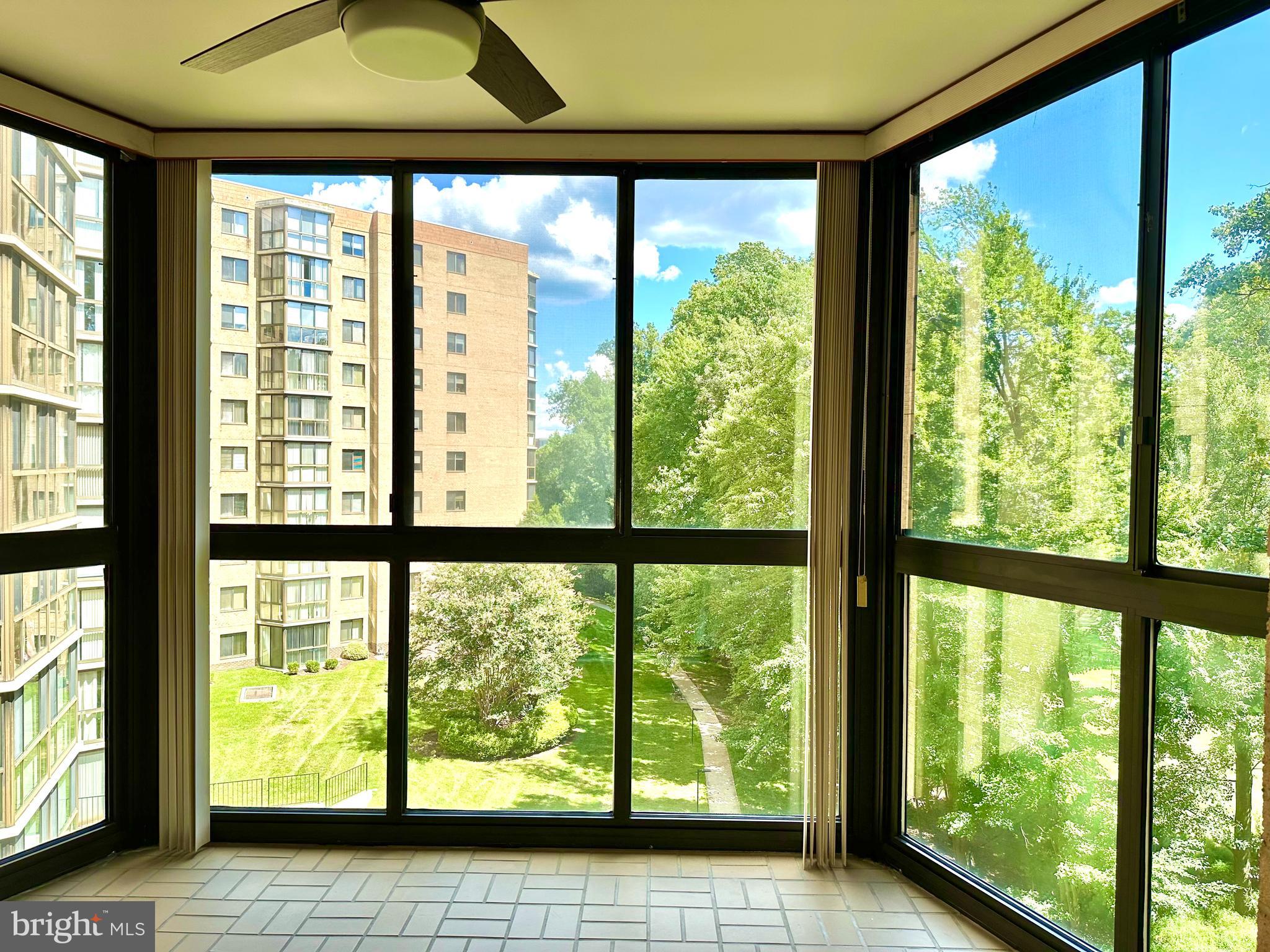 3310 North Leisure World Boulevard, Unit 5036 Silver Spring, MD 20906 - Photo 7 of 28 Enclosed Sunroom