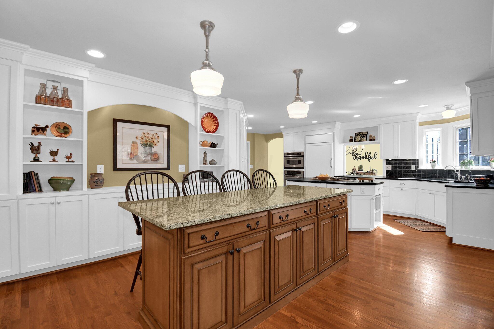 1921 Andover Road Columbus, OH 43212 - Photo 17 of 72 Granite countertop second island with wall of custom cabinets