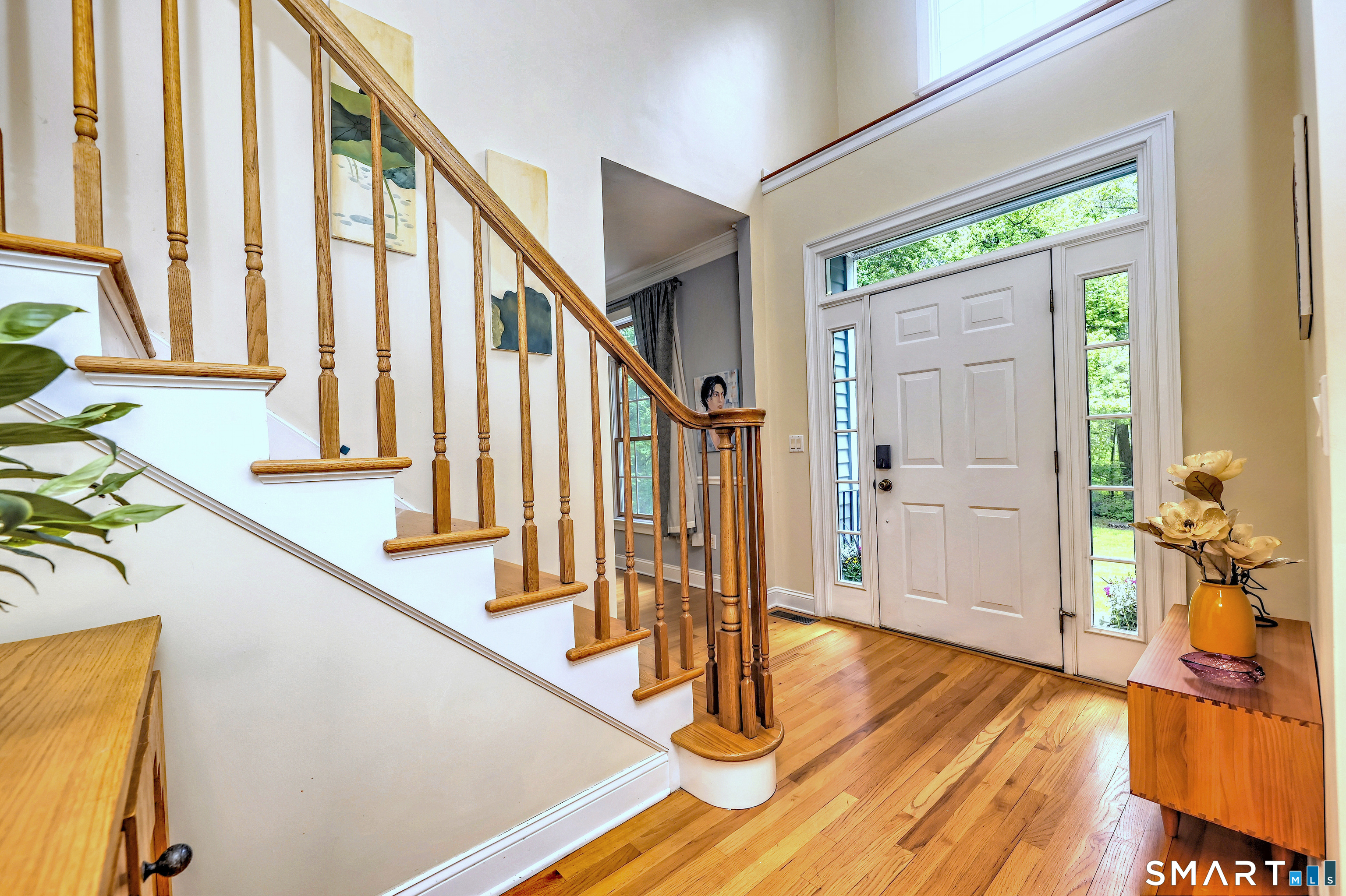 125 Peck Hill Road Woodbridge, CT 06525 - Photo 3 of 40 a view of an entryway with wooden floor and staircase