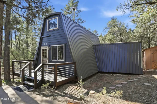 a house view with a backyard space