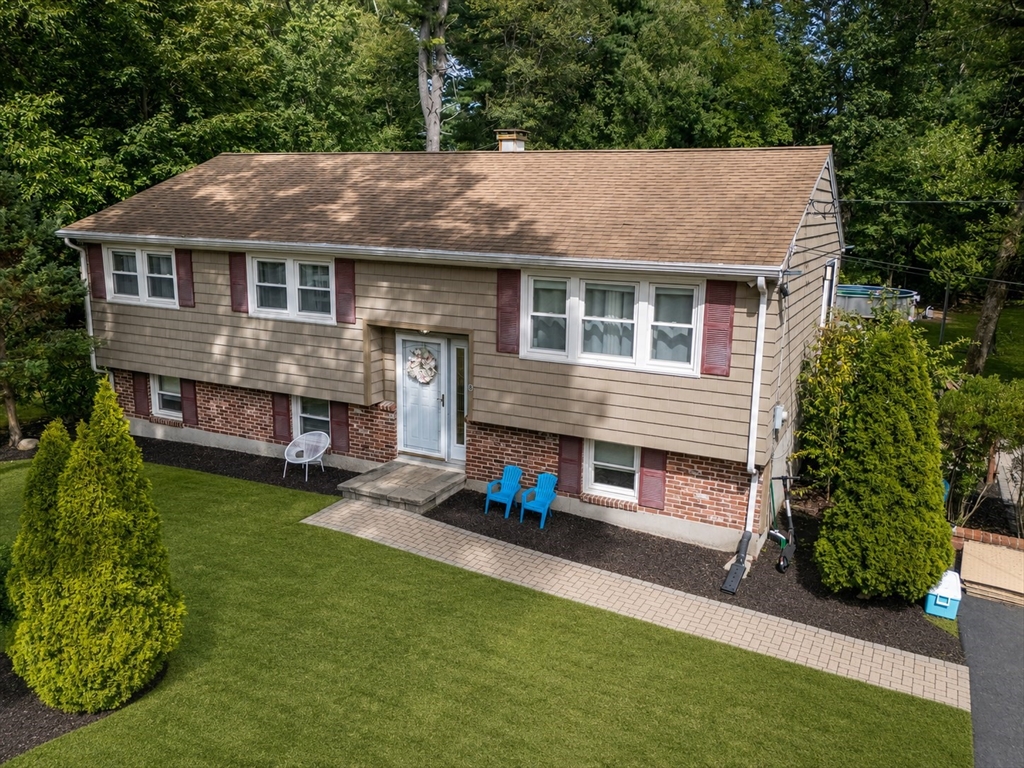 8 Governor Fuller Road Billerica, MA 01821 - Photo 2 of 33 a aerial view of a house with a yard patio and fire pit