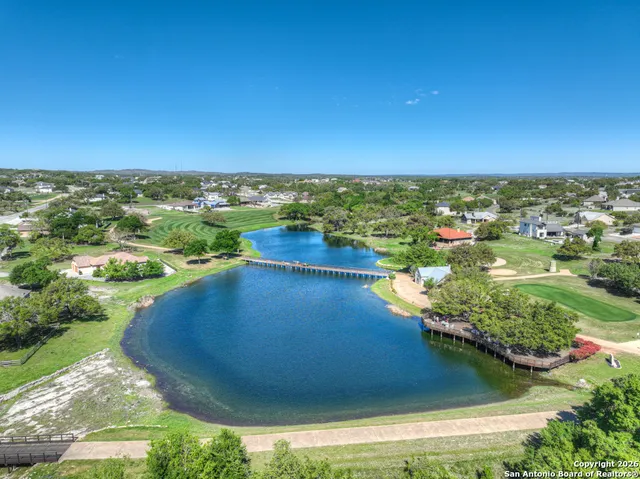 a view of a lake with a yard