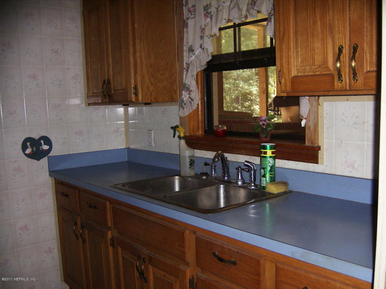 54002 Parks Road Callahan, FL 32011 - Photo 6 of 11 a kitchen with a sink cabinets and window