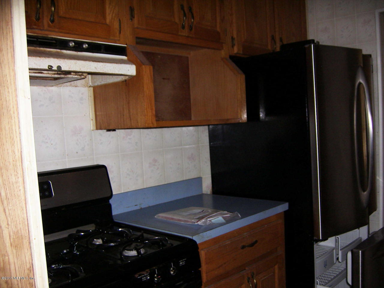 54002 Parks Road Callahan, FL 32011 - Photo 7 of 11 a kitchen with a refrigerator and a stove