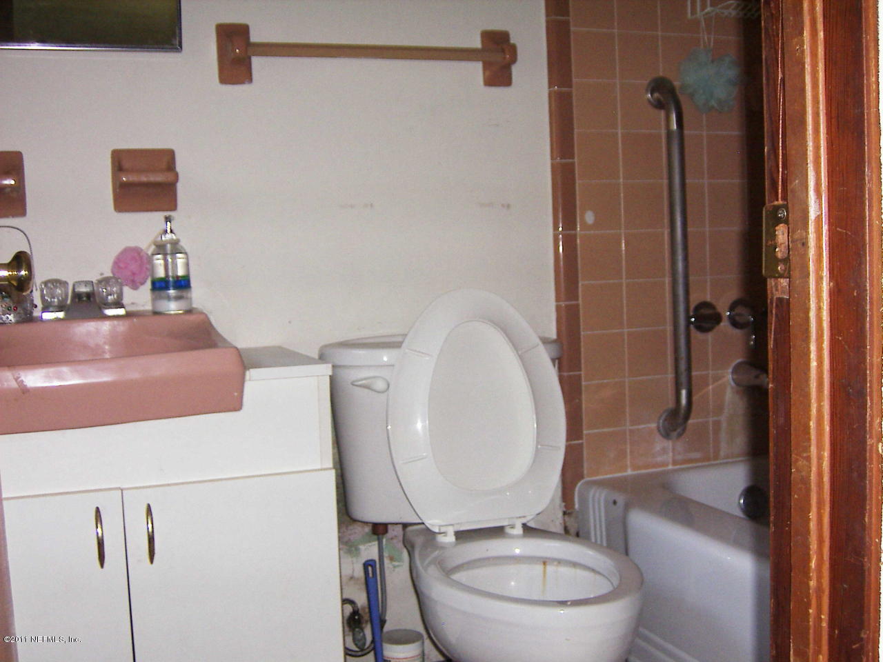 54002 Parks Road Callahan, FL 32011 - Photo 10 of 11 a bathroom with a granite countertop toilet sink and mirror