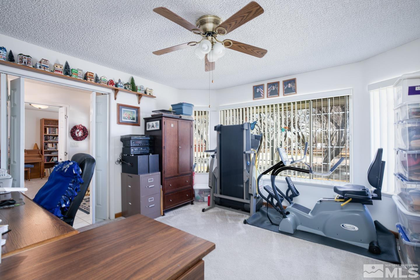 930 Edgewater Lane Fallon, NV 89406 - Photo 11 of 30 a room with gym equipment and large mirror