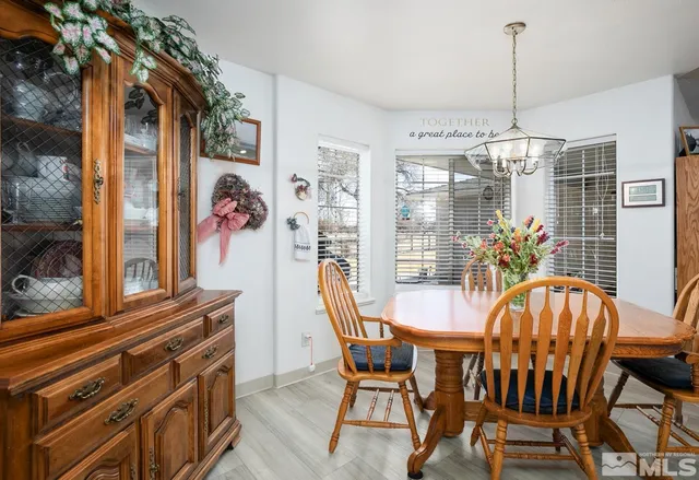 a view of a dining room with furniture window and outside view