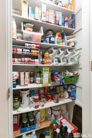 a room with lots of different kinds of flowers