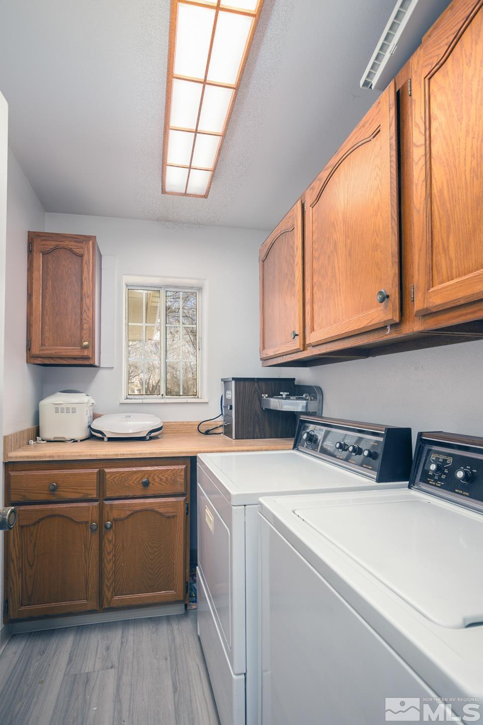 930 Edgewater Lane Fallon, NV 89406 - Photo 22 of 30 a utility room with stainless steel appliances a sink a stove and cabinets