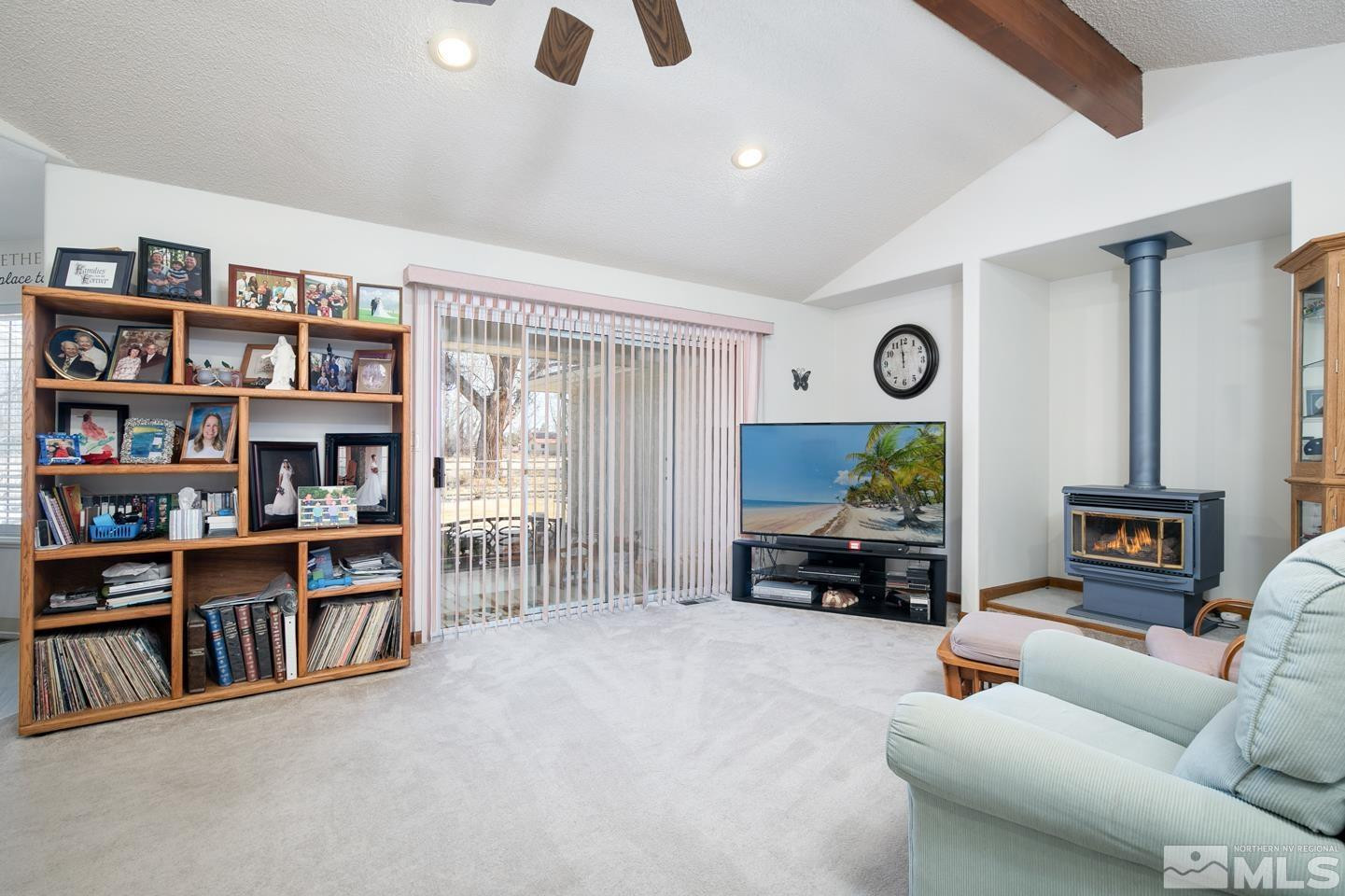 930 Edgewater Lane Fallon, NV 89406 - Photo 9 of 30 a living room with furniture and a bookshelf