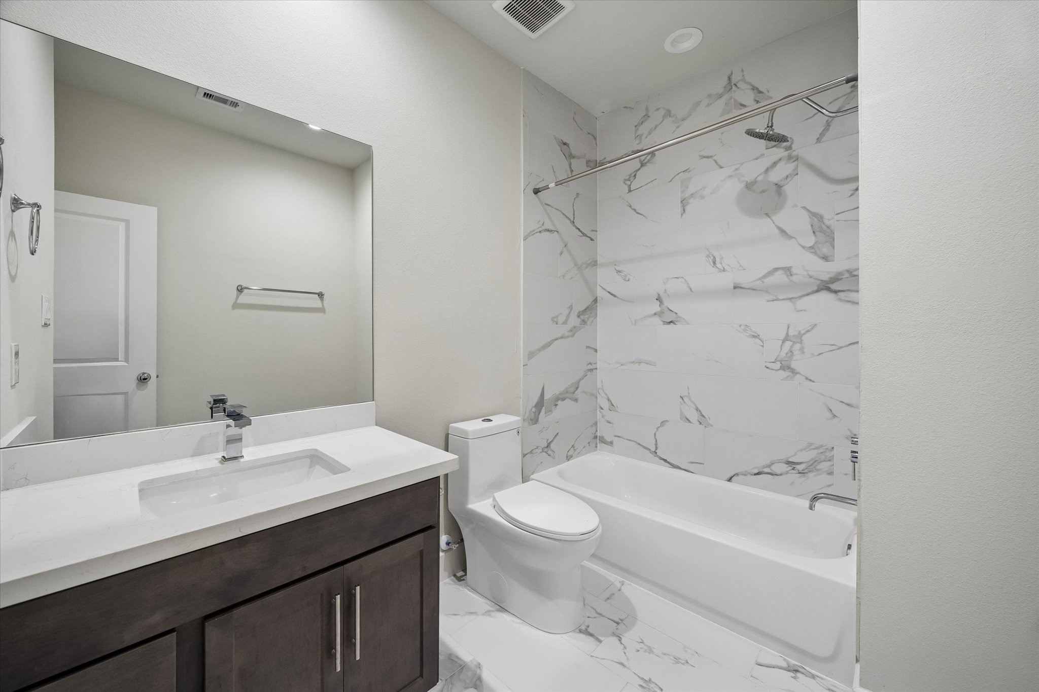 5914 Haring Lane Houston, TX 77091 - Photo 5 of 11 a bathroom with a sink a toilet and shower