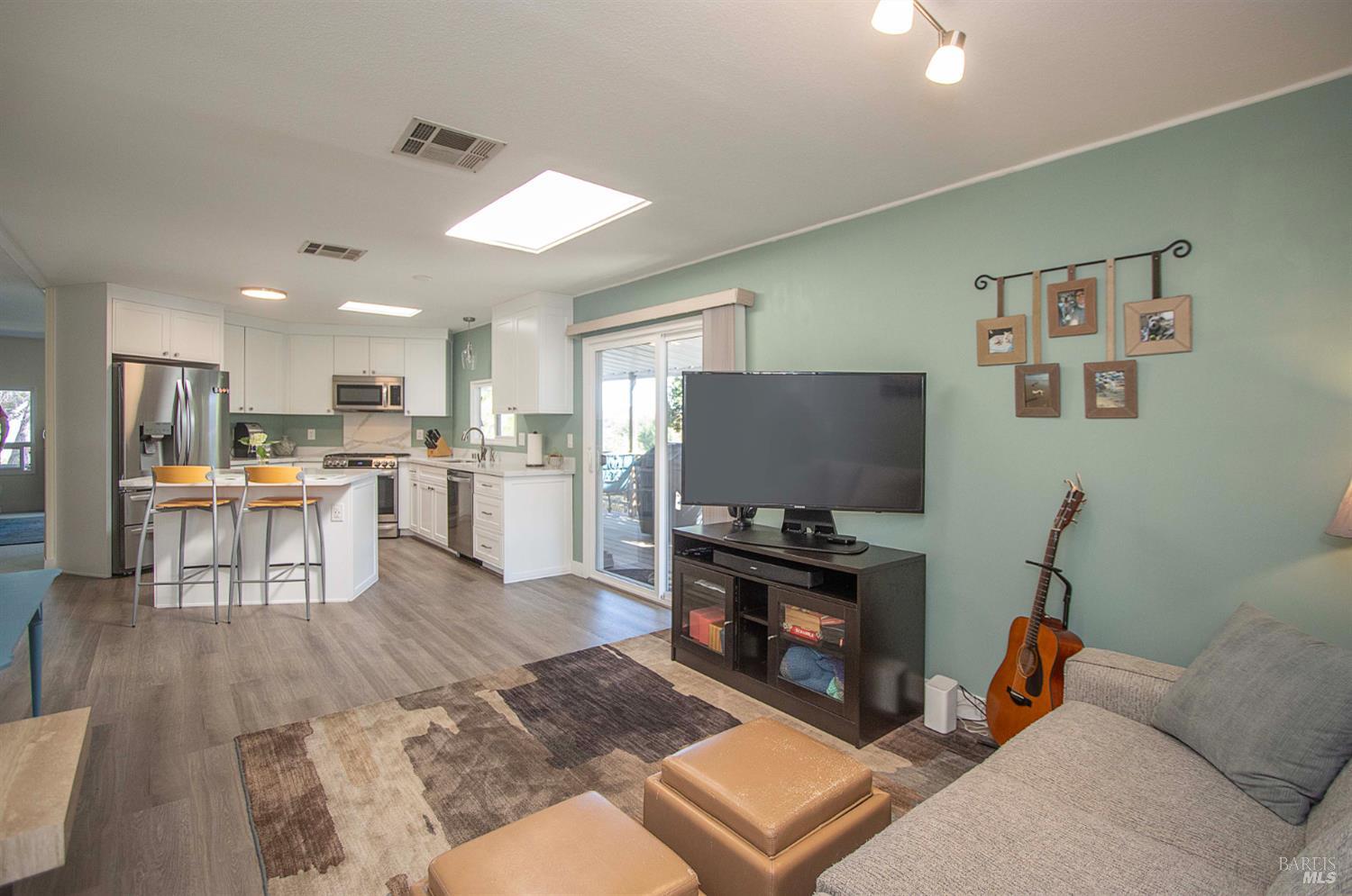 9 Fallen Leaf Way Novato, CA 94949 - Photo 19 of 32 a living room with furniture and kitchen view
