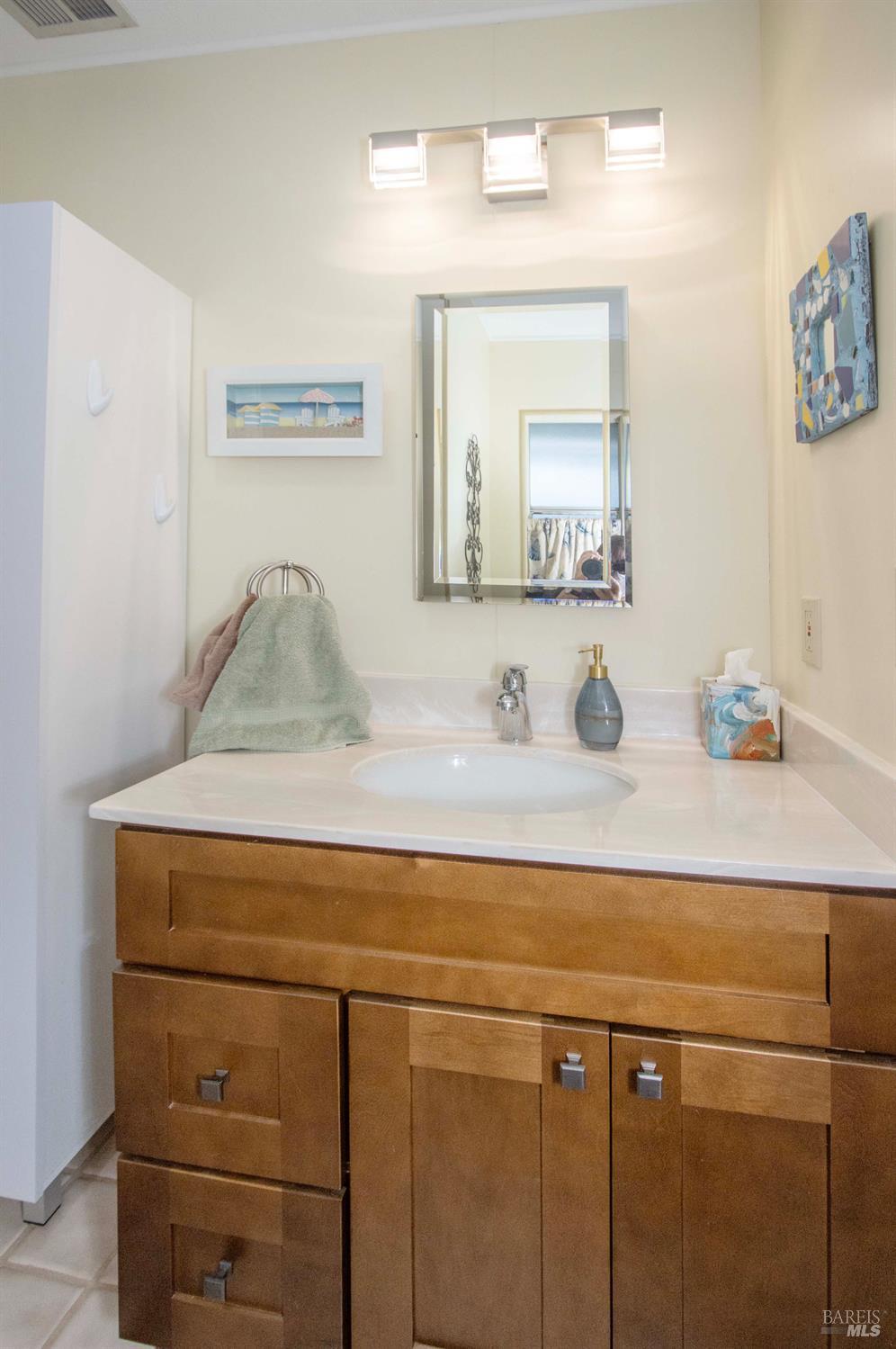 9 Fallen Leaf Way Novato, CA 94949 - Photo 20 of 32 a bathroom with a sink and a mirror