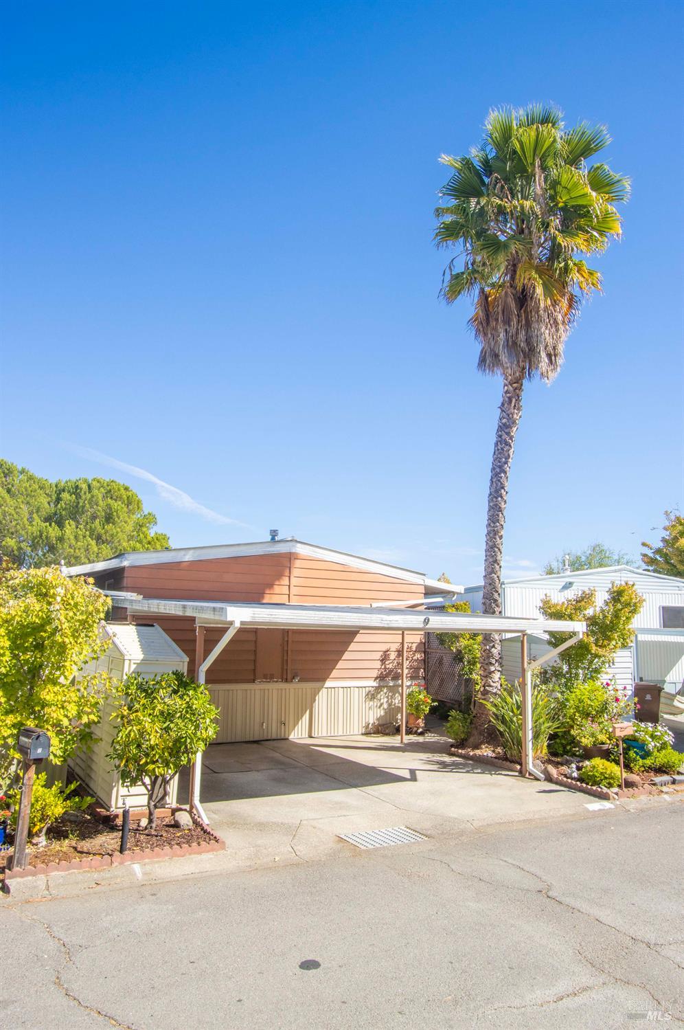 9 Fallen Leaf Way Novato, CA 94949 - Photo 30 of 32 a vase of flowers sitting on a table with a table and chair