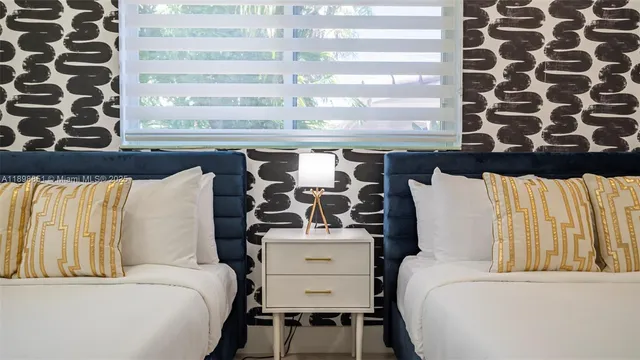 a living room with furniture a table and a potted plant