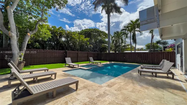 a view of an chairs and table in the patio