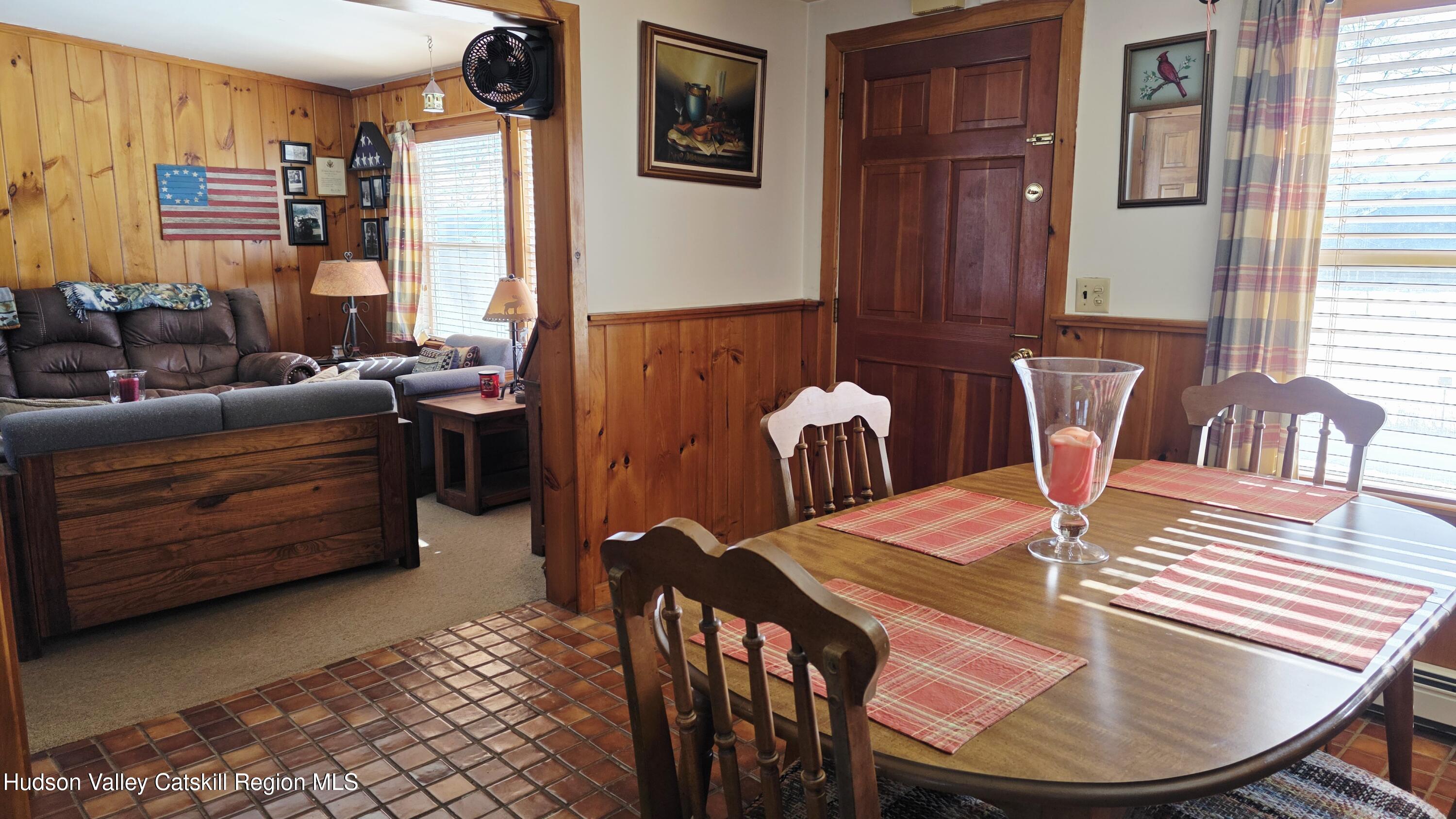334 Stonitch Road East Durham, NY 12423 - Photo 14 of 46 a dining room with furniture and wooden floor
