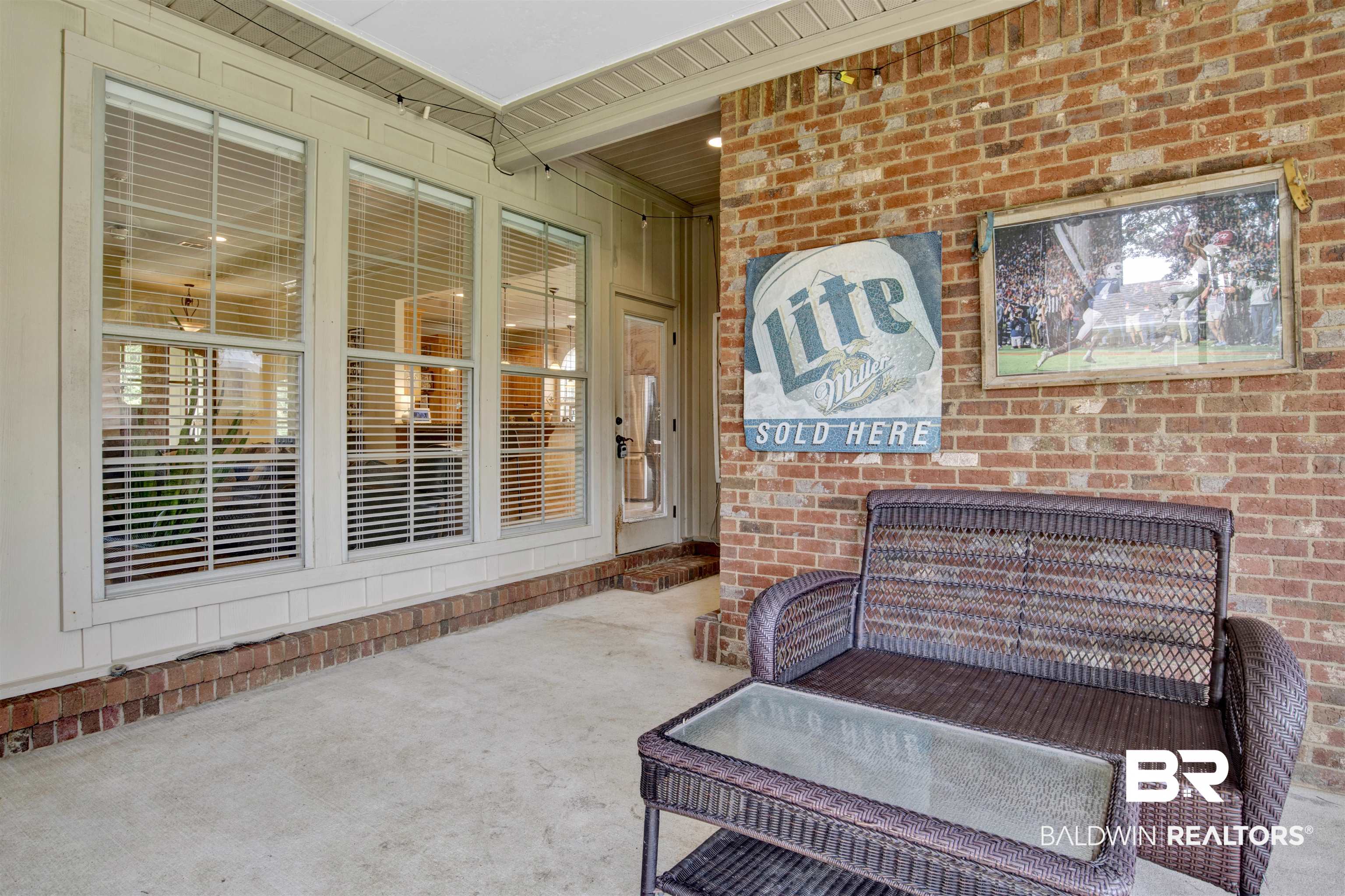 10368 Gayfer Rd Extension Fairhope, AL 36532 - Photo 31 of 43 Covered patio featuring a concrete slab and a brick accent wall