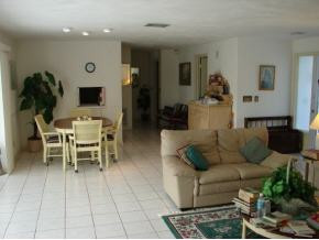 425 Samar Avenue Naples, FL 34113 - Photo 4 of 7 a living room with furniture and wooden floor