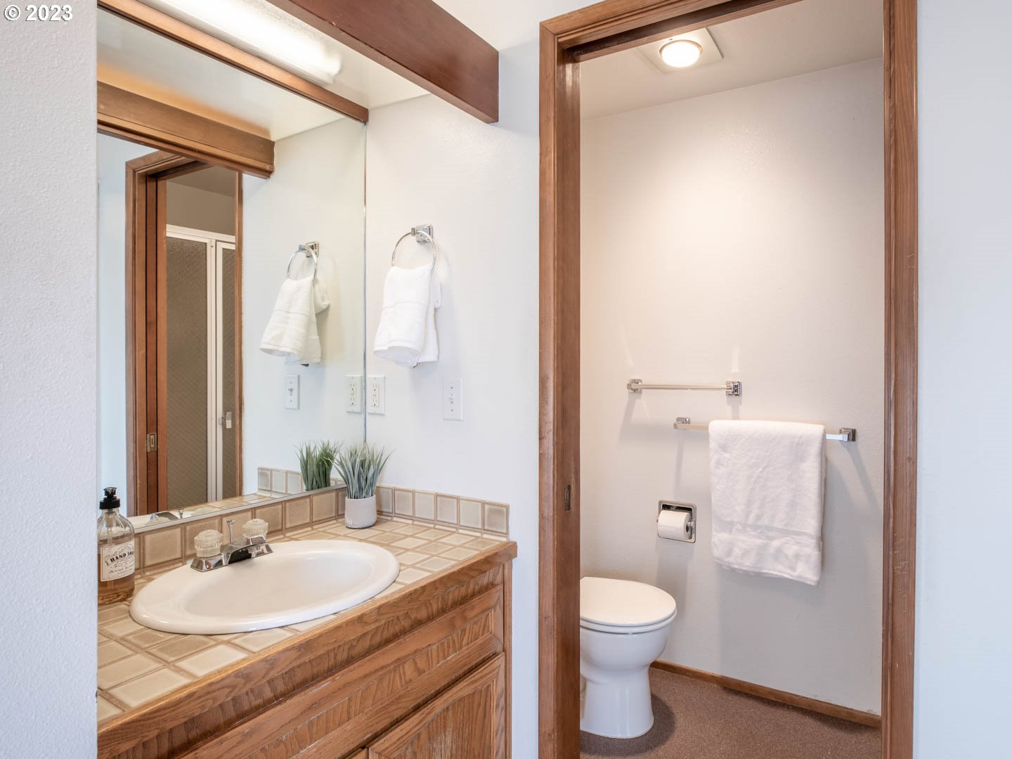 782 Montview Way Springfield, OR 97477 - Photo 9 of 14 a bathroom with a granite countertop sink toilet and a mirror