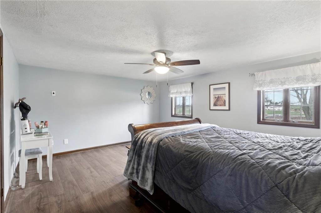 378 Mingo Church Road Finleyville, PA 15332 - Photo 27 of 48 a bed sitting in a bedroom next to a window with a chandelier