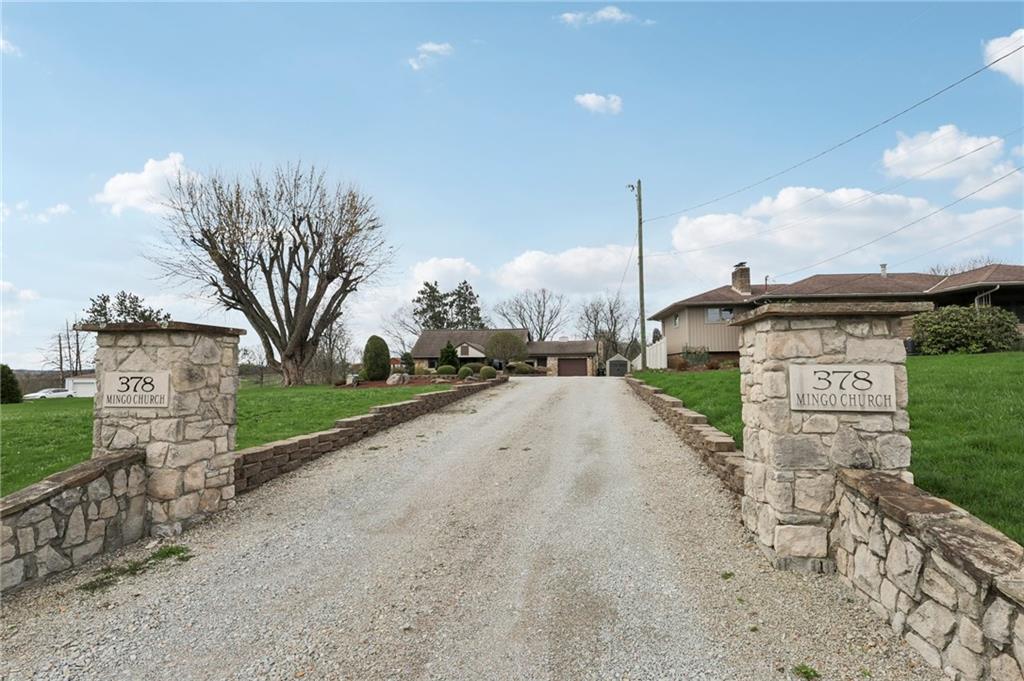 378 Mingo Church Road Finleyville, PA 15332 - Photo 4 of 48 a sign board with buildings in the background