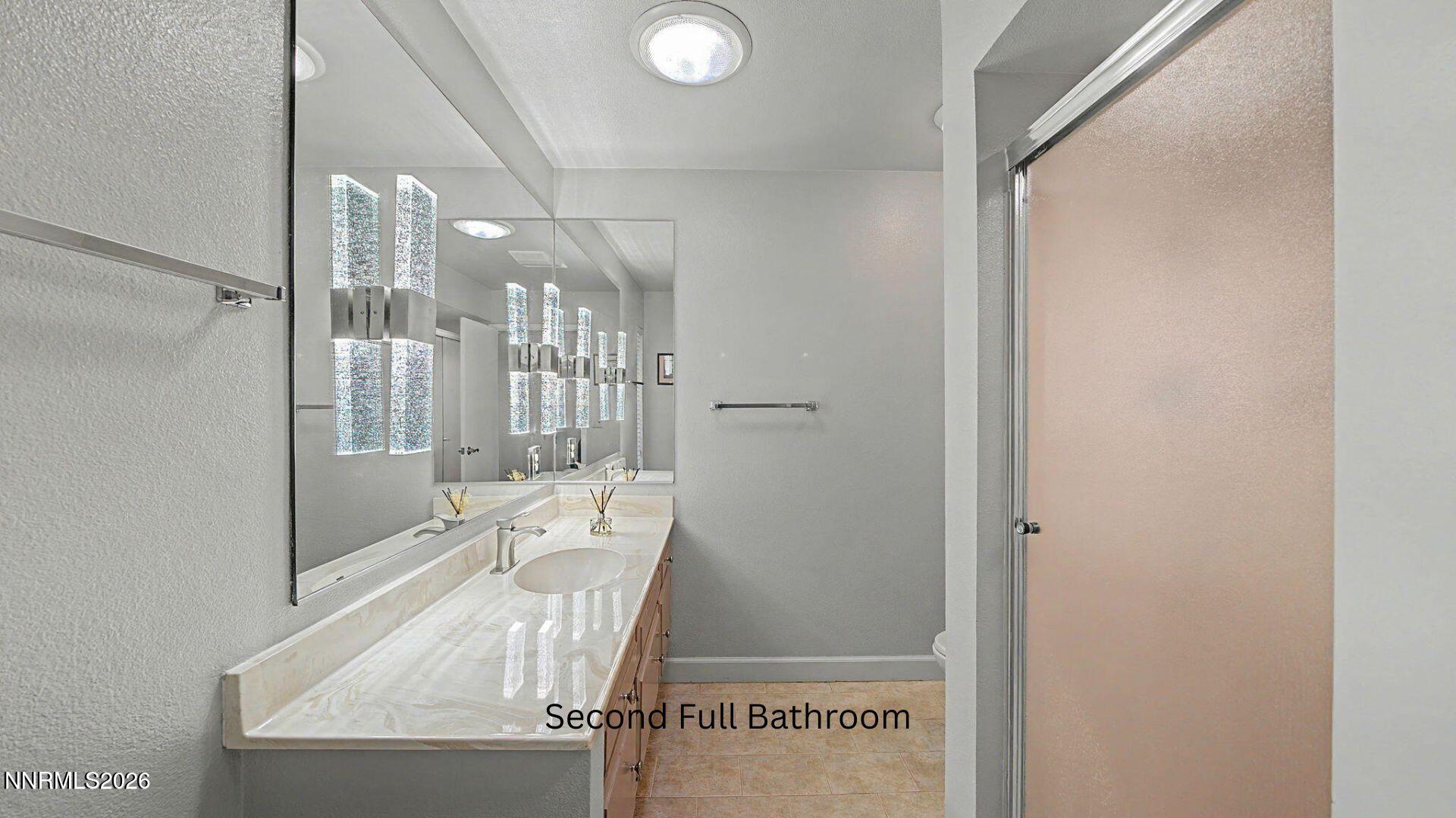 4920 Plumas Street Reno, NV 89509 - Photo 19 of 36 a bathroom with a sink and mirror