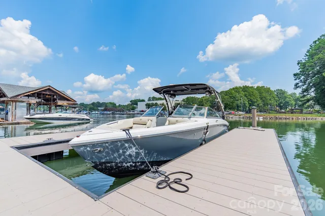 a view of a lake with couches and city view