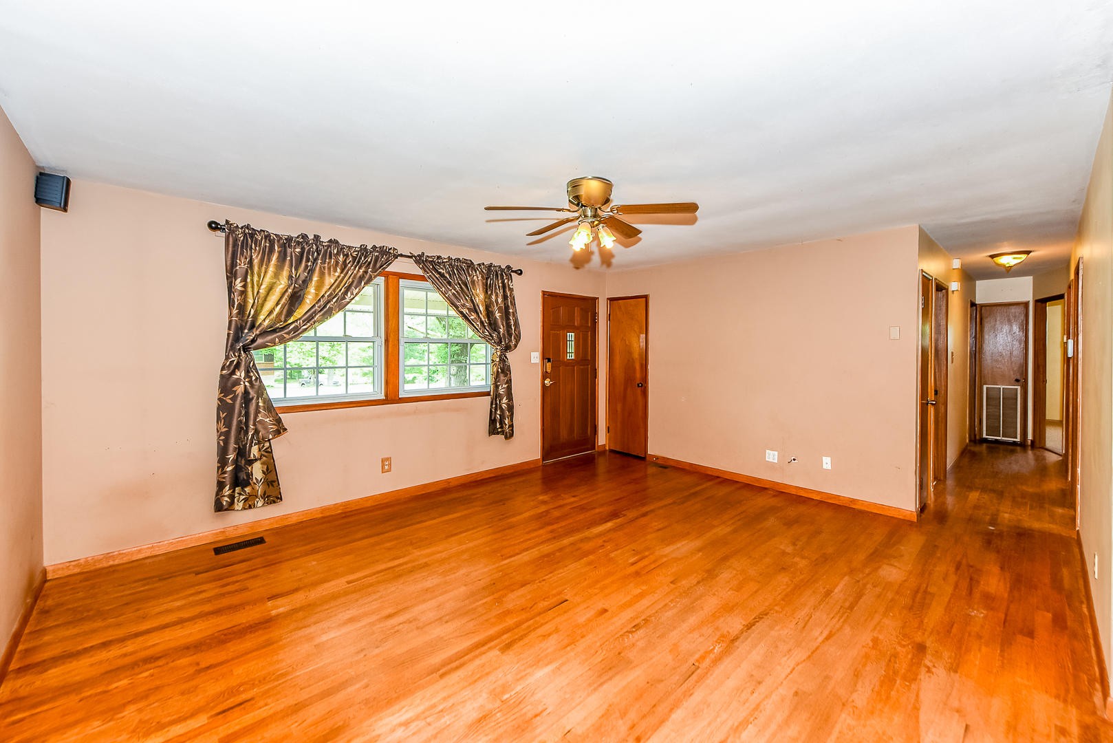 3012 Lafayette Road Knoxville, TN 37921 - Photo 3 of 11 a view of an empty room with a window and wooden floor