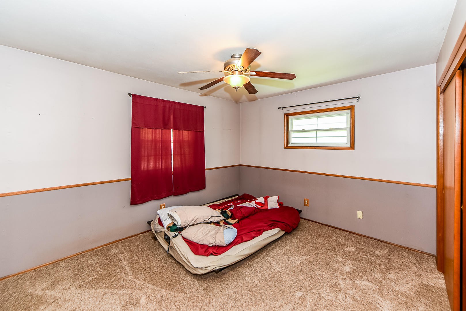 3012 Lafayette Road Knoxville, TN 37921 - Photo 10 of 11 a bedroom with a bed and a chandelier