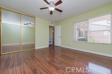 14 Featherwood Irvine, CA 92612 - Photo 13 of 32 a view of an empty room with wooden floor and a window