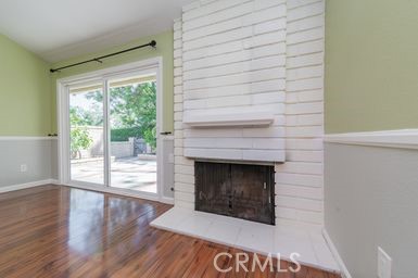14 Featherwood Irvine, CA 92612 - Photo 6 of 32 a room with fireplace and wooden floor