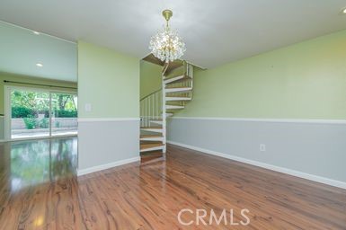 14 Featherwood Irvine, CA 92612 - Photo 8 of 32 a view of empty room with wooden floor and fan