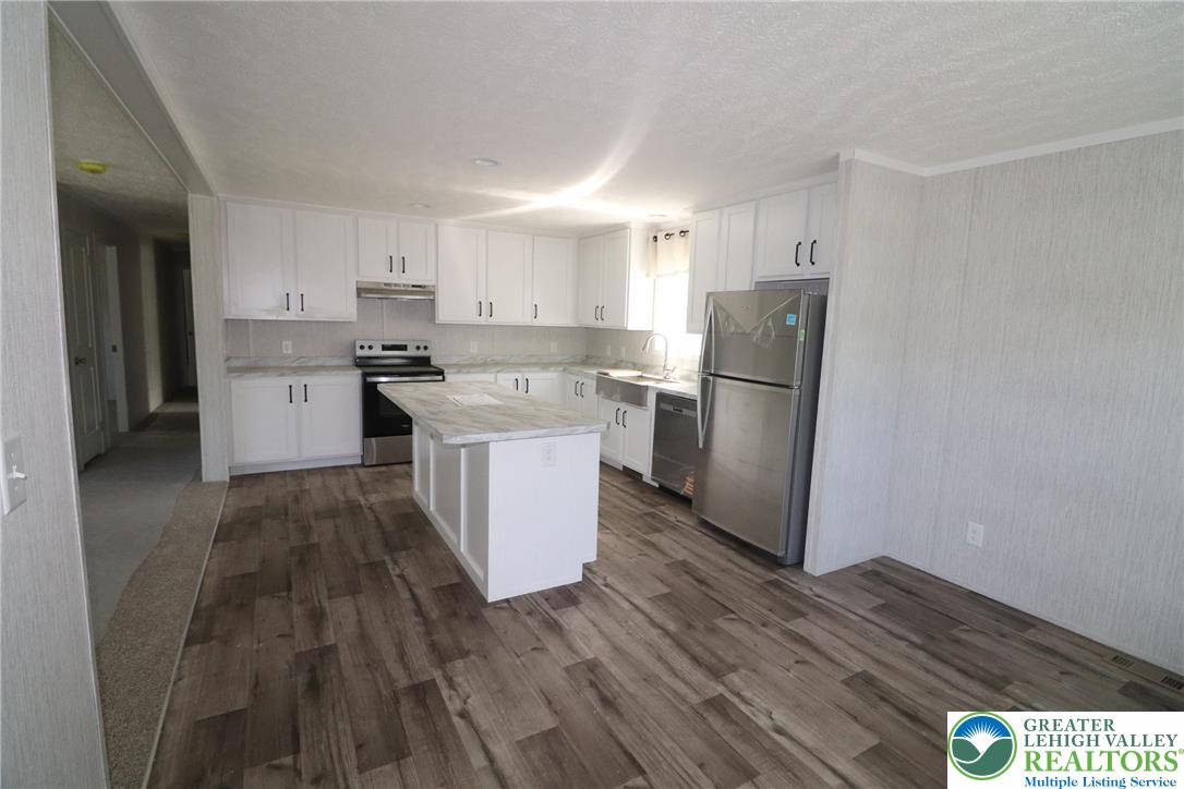 5020 Old Timber Road Stroudsburg, PA 18360 - Photo 11 of 32 a kitchen with a refrigerator a stove top oven and a counter space