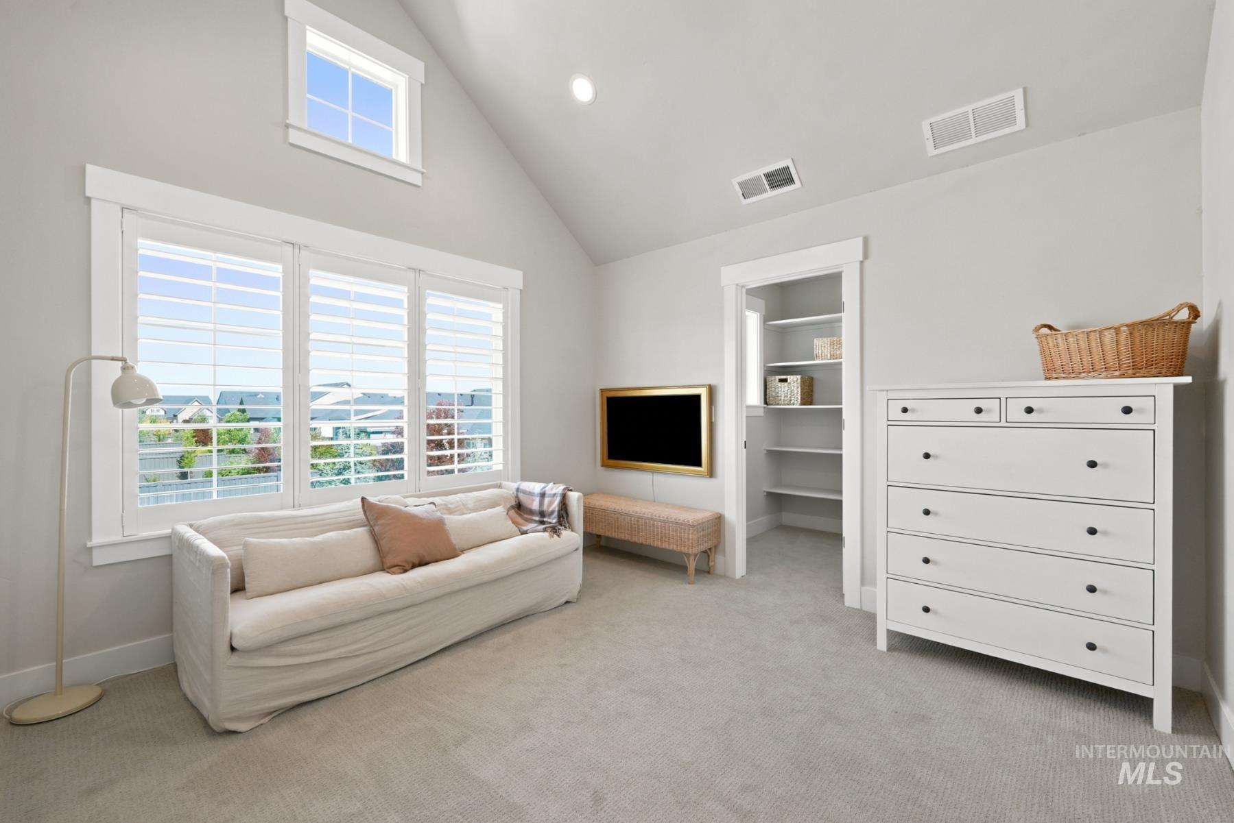 6933 South Zenith Avenue Meridian, ID 83642 - Photo 20 of 34 Vaulted ceiling room featuring ample natural light from multiple windows