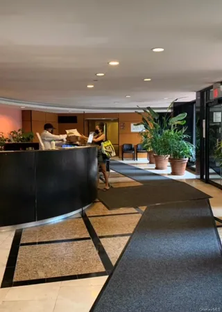 a view of swimming pool with seating space